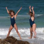Nina Agdal and Iskra Lawrence get wet doing jumping jacks in swimsuits