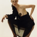 Rianne van Rompaey topless with a black nipple pasty
