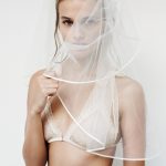 Rozanne Verduin in a white bra and and veil