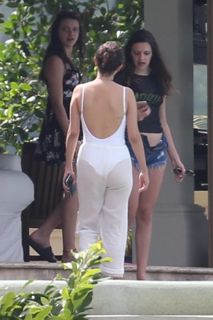 Selena Gomez showing her ass in sheer pants