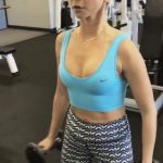 Sarah Hyland lifting weights in her blue bra
