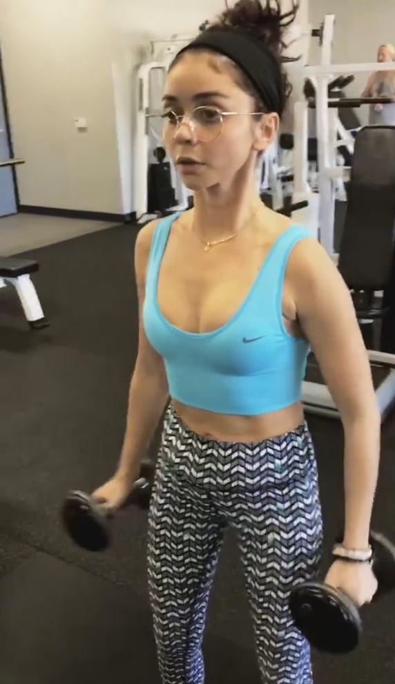 Sarah Hyland lifting weights in her blue bra