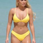 Amber Turner fat pussy in a yellow bikini on the beach