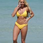 Amber Turner in a yellow bikini on the beach