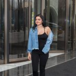 Ariel Winter in hong kong in a jean jacket and tight bodysuit