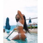 Ashanti getting wet in a tight white bikini