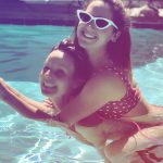 Ashley Tisdale in the pool with a girlfriend