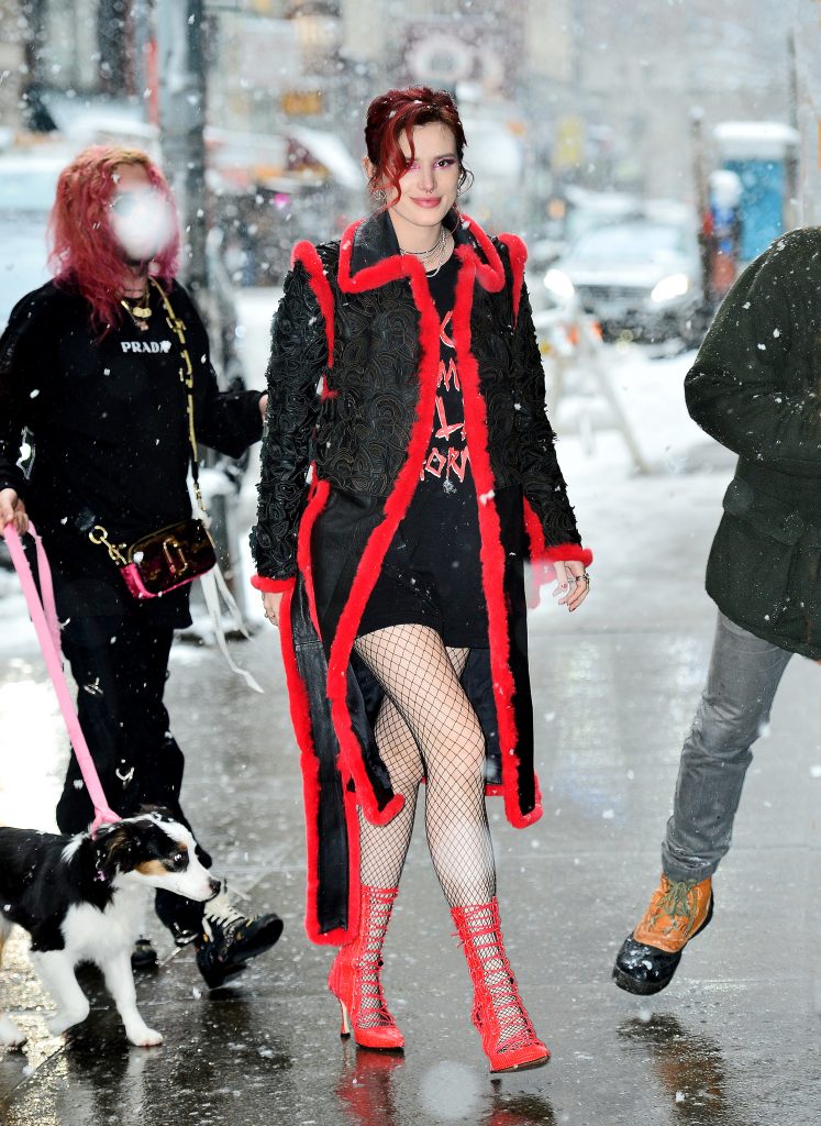 Bella Thorne looks ravishing in red as she steps out during a snowstorm in NYC