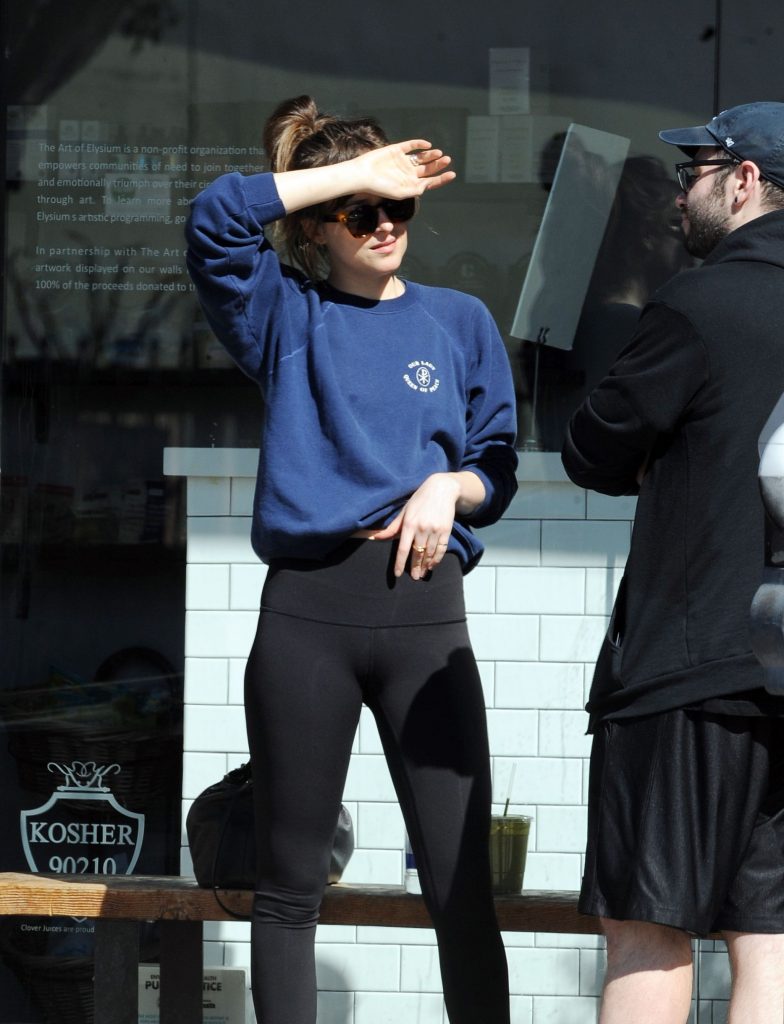 Dakota Johnson tight black leggings and a cameltoe