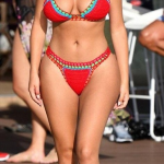 Demi Rose in a tight red bikini