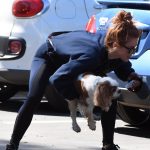 Julian Hough Leggings Picking up her Dog