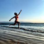 Katherine Heigl in a red bikini running on the beach