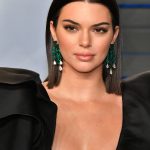Kendall Jenner tits in a low cut black dress