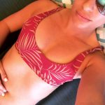 LEa Michele shows her cleavage in her red bikini bra