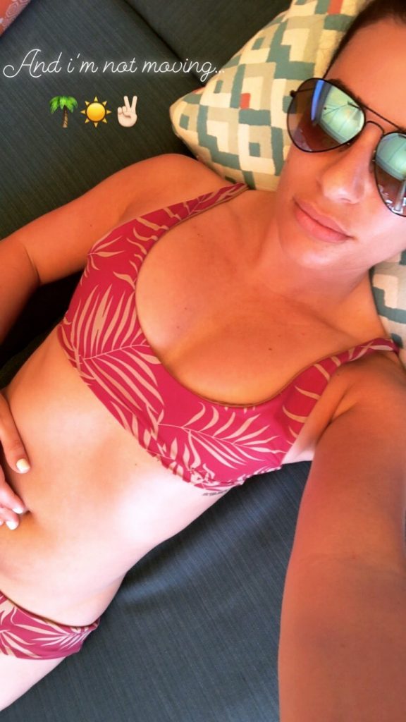 LEa Michele shows her cleavage in her red bikini bra