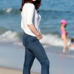 Lana Del Rey booty on the beach in jeans