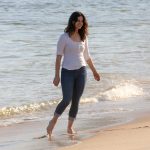 Lana Del Rey booty on the beach in jeans
