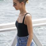 Nicole Richie cleavage in a black bodysuit and jean shorts