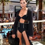 Olivia Culpo in a black bra and panties by the pool