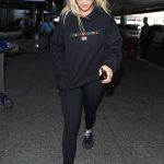 Rita Ora rocks her clothing line and Balenciaga sneakers at LAX