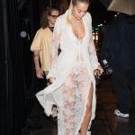 Rita Ora showing her white sheer panties in a lace dress