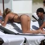 Samantha Hoopes bending over showins her ass in a red bikini