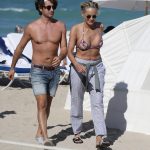 Sharon Stone enjoys a day at the beach in Miami with her boyfriend, showing off her incredible figure in a string bikini the day before she turns 60