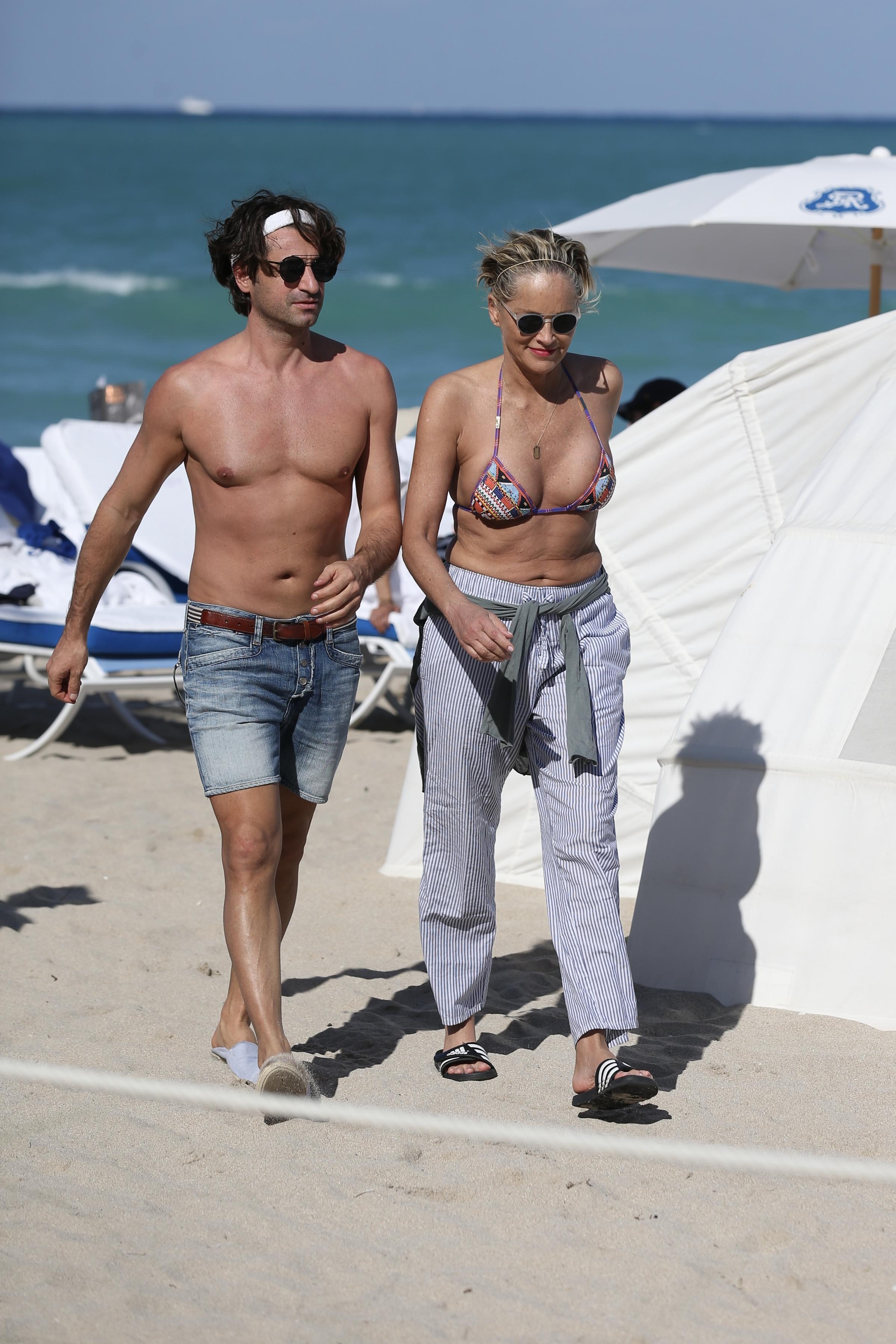 Sharon Stone enjoys a day at the beach in Miami with her boyfriend, showing  off her