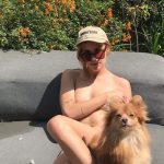 Tallulah Willis naked covering her tits with her dog