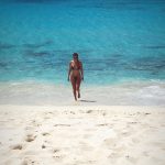 Kourtney Kardashian tits in a brown thong bikini on the beach