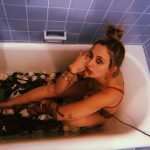 Paris Jackson in Red BRa in a Bathtub Filled with Flowers