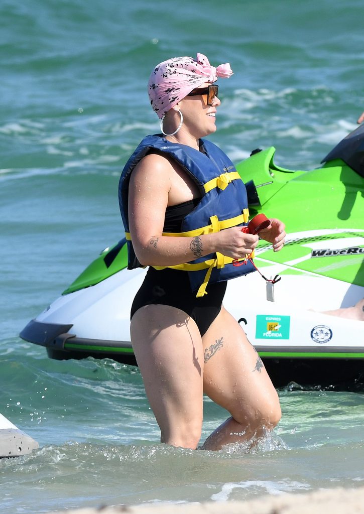 Pink Big Mom Thighs and Ass in a black wet swimsuit in fort lauderdale