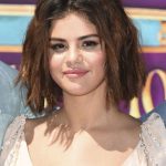 Selena Gomez Tits in a Low Cut White Dress