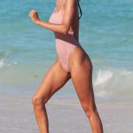 Lais Ribeiro getting wet in a tight pink swimsuit