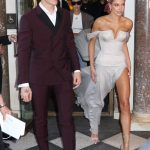 Hailey Baldwin TIts Out in a WHite Dress at the MET