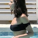 Olivia Culpo & Cara Santana in the pool in a black thong bikini
