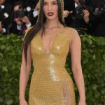 Olivia Munn TIts in a GOld Dress at the MET