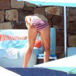 Reese Witherspoon bends over in a bikini