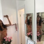 Rosario Dawson Naked in the Mirror covering her Pussy with Roses