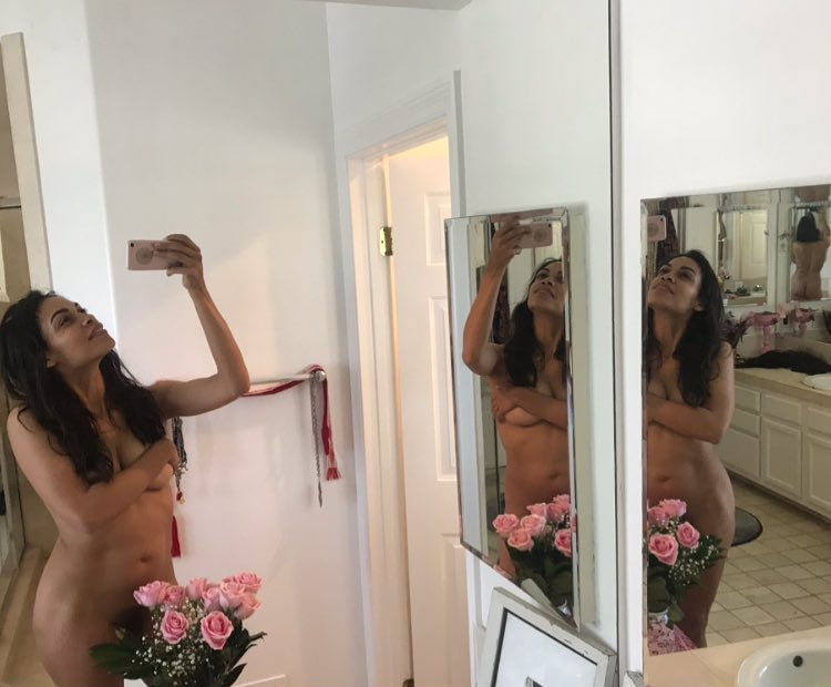 Rosario Dawson Naked in the Mirror covering her Pussy with Roses