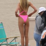 romee strijd tits and ass in a bright pink swimsuit