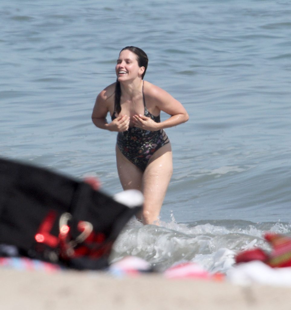 Sophia Bush Tucks Her Titties away as she gets wet in a swimsuit on the beach