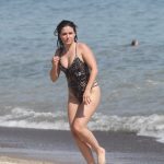 Sophia Bush Tucks Her Titties away as she gets wet in a swimsuit on the beach