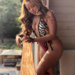 Angela Simmons Ass and Tits in a Oncepiece Stipper Bikini