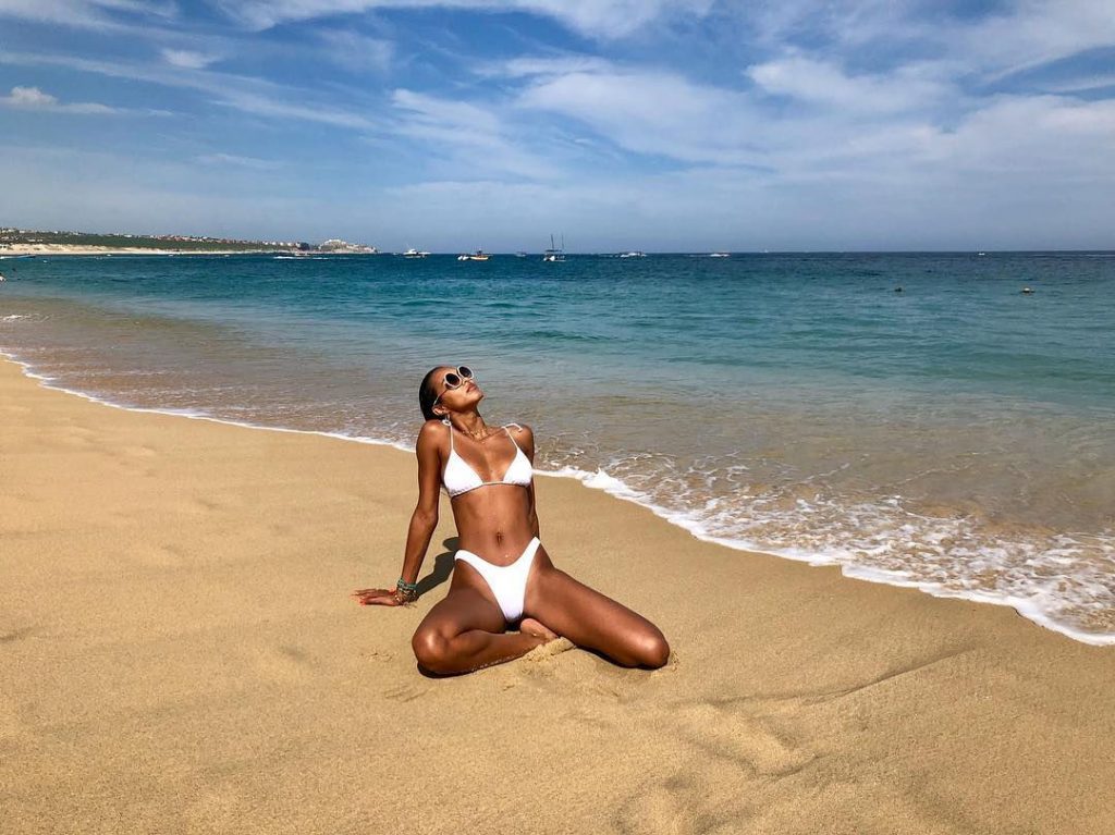 Lais ribeiro spreading her legs in white bikini on beach